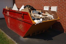 Red skip filled with rubbish